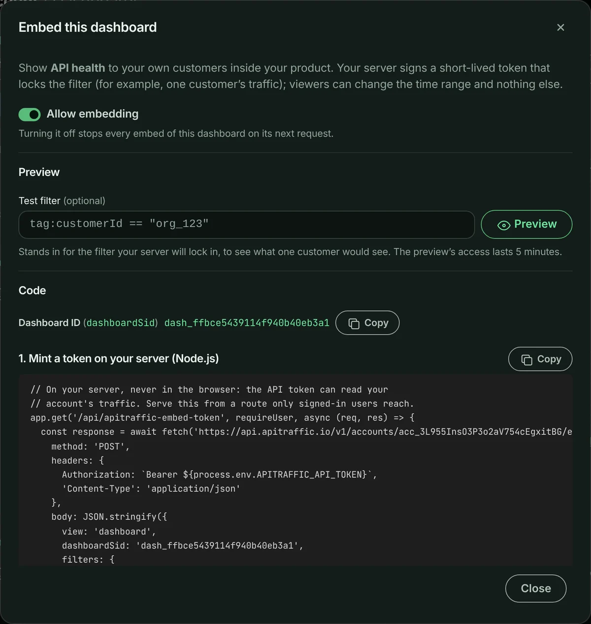 Embed this dashboard dialog with Allow embedding on, a test filter to preview one customer’s view, and the Node.js code that mints the embed token on your server