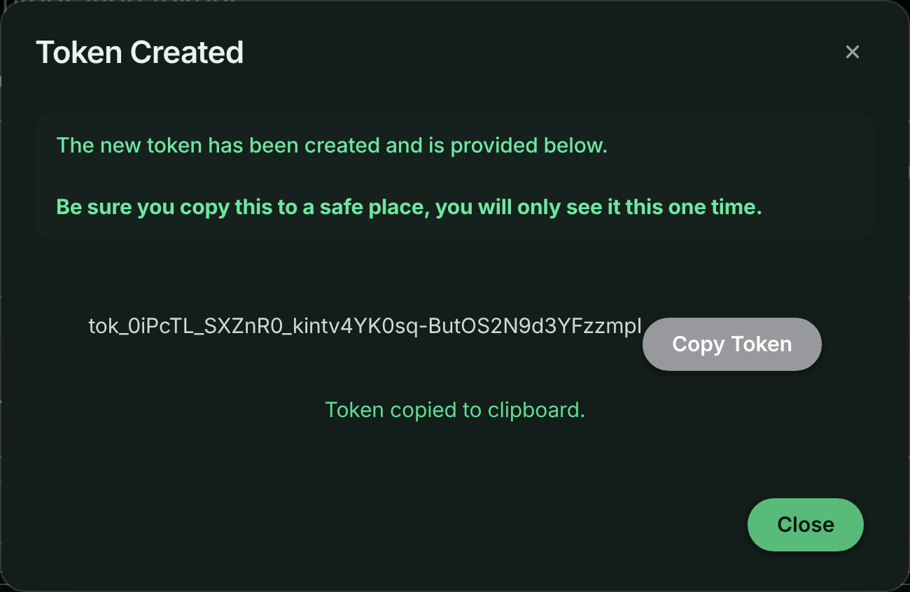Token Created dialog with the full token value, a Copy Token button and a reminder that it is shown only once